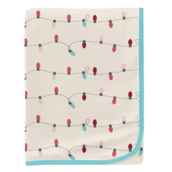 PRINT SWADDLING BLANKET IN NATURAL HOLIDAY LIGHTS